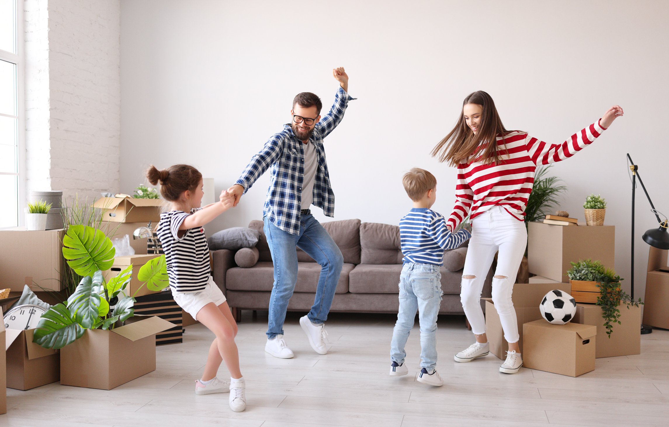 Parents dancing with children during relocation